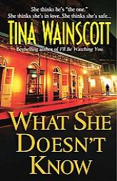 What She Doesn't Know by Tina Wainscott Paperback Book