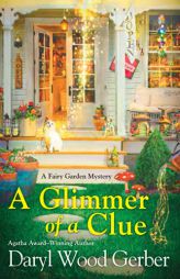 A Glimmer of a Clue (A Fairy Garden Mystery) by Daryl Wood Gerber Paperback Book